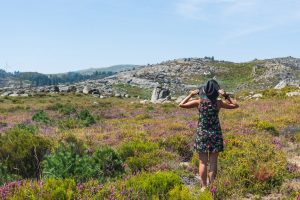 Girl in the flowers at Alvao Natural Park in Portugal