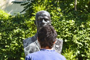 Rui standing in front of a statue at the Museum of Socialist Art in Sofia Bulgaria