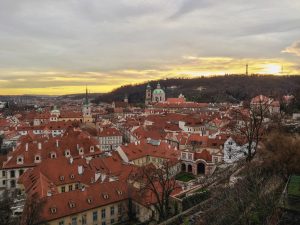 Sunset over the infinite redroofs of Prague